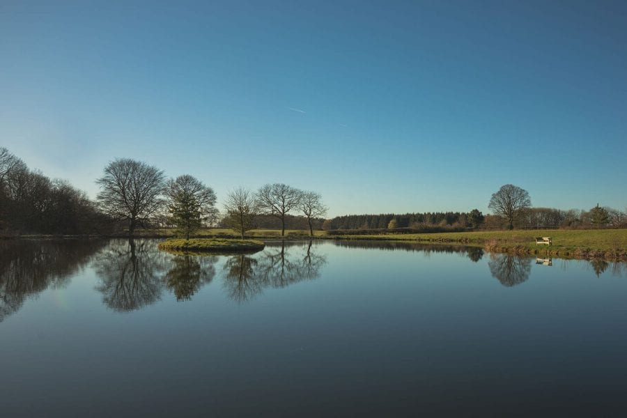 View across the lake and island on the Farleigh House estate