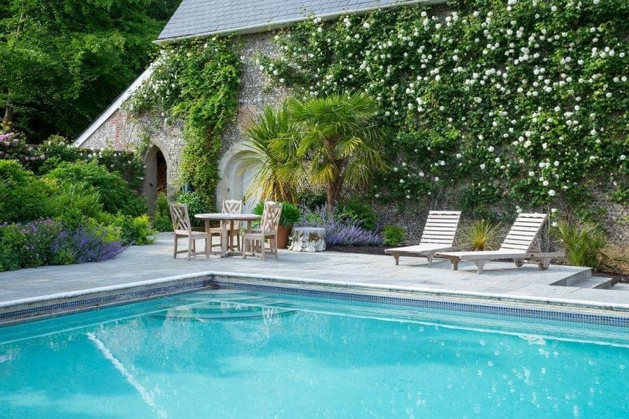 swimming pool with sun loungers