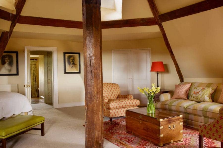 Interior of a beamed bedroom at Farleigh House