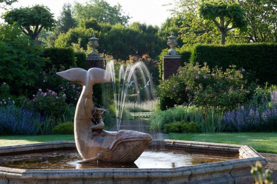 Coade Stone Whale statue in the gardens of Farleigh House