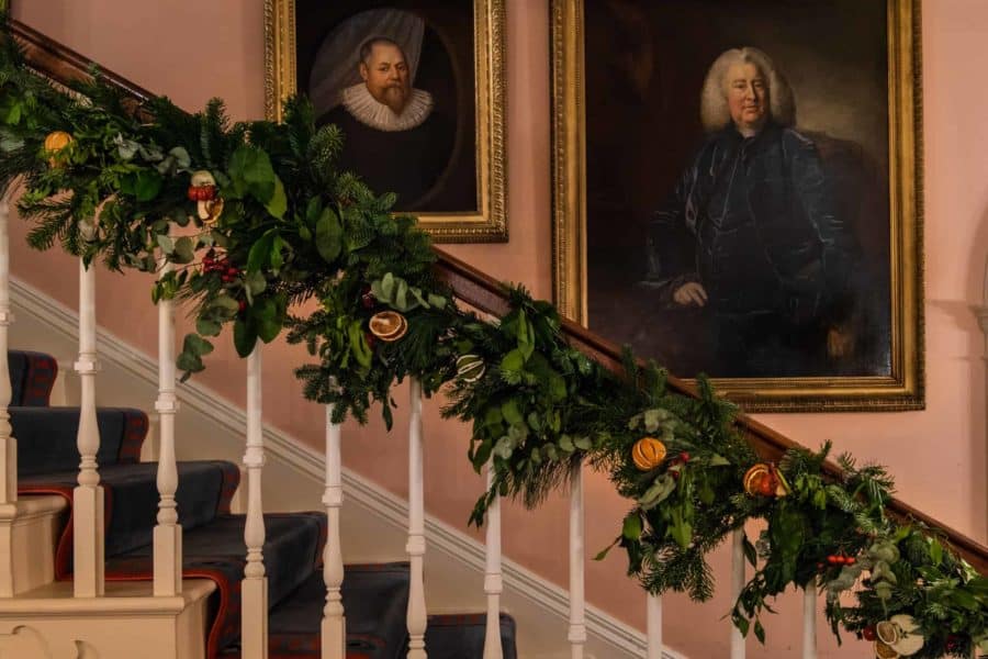Farleigh House staircase decorated for Christmas
